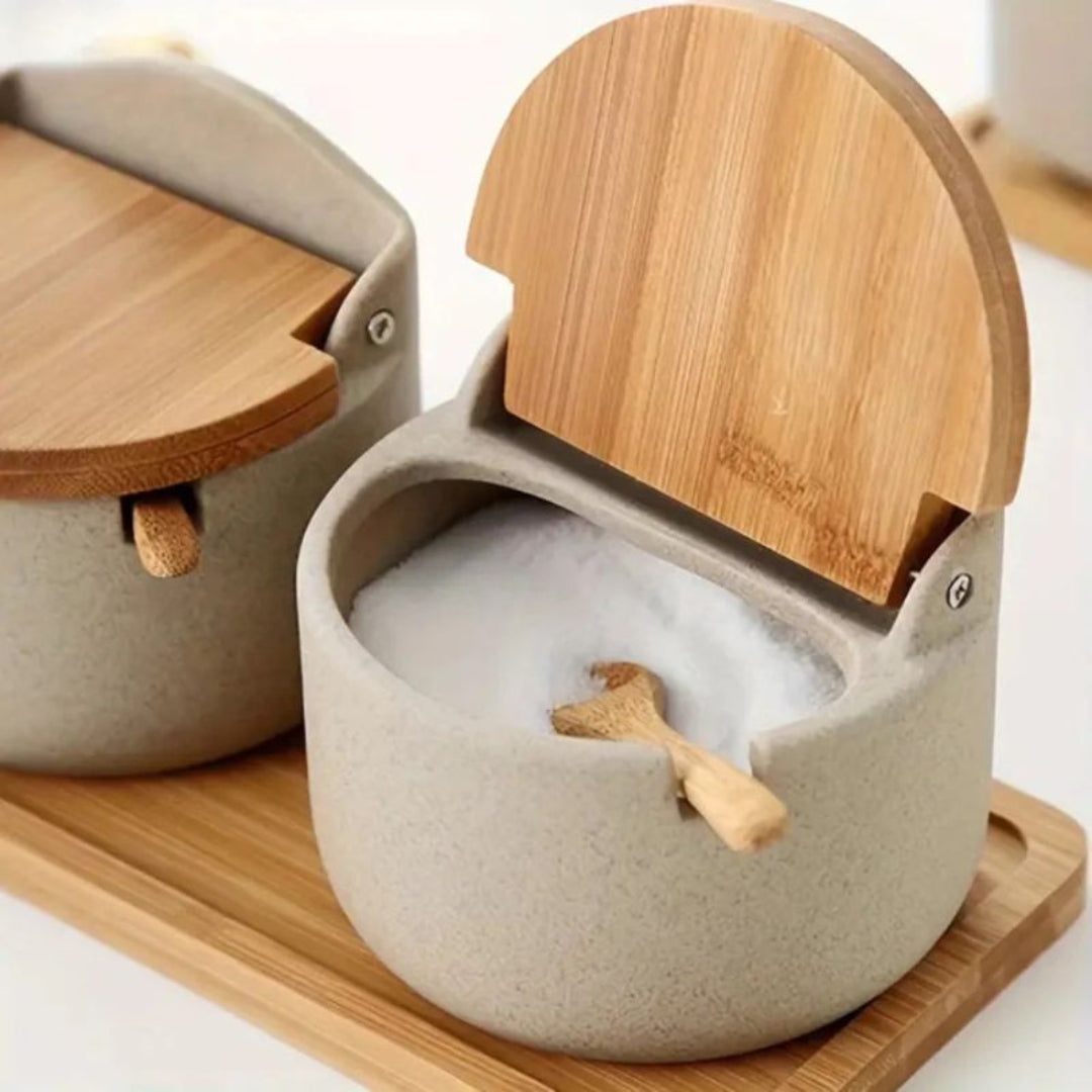 Concrete container with wooden lid on a wooden tray