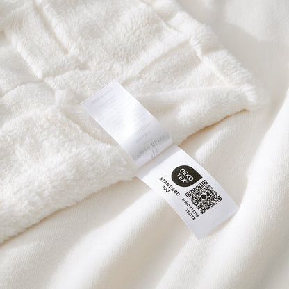Close-up of a white fabric with a label on a white background