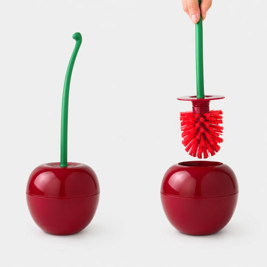 Josh & Tate - CherryPop™ Toilet Brush & Holder - A cherry-shaped toilet brush set shown in two views on a light gray background: one closed with a green stem and one open with a hand holding the green handle, revealing red bristles.
