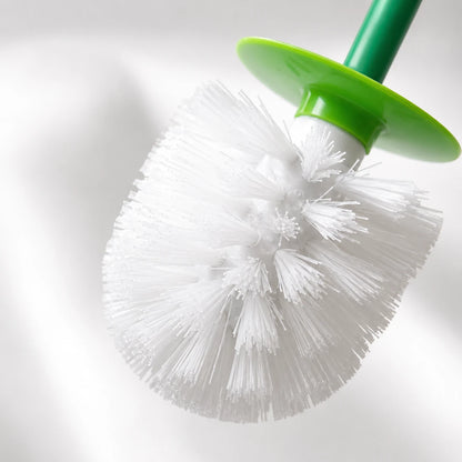 Josh & Tate - CherryPop™ Toilet Brush & Holder - A close-up of a toilet brush with white bristles, a green plastic collar, and a green handle against a soft white background.