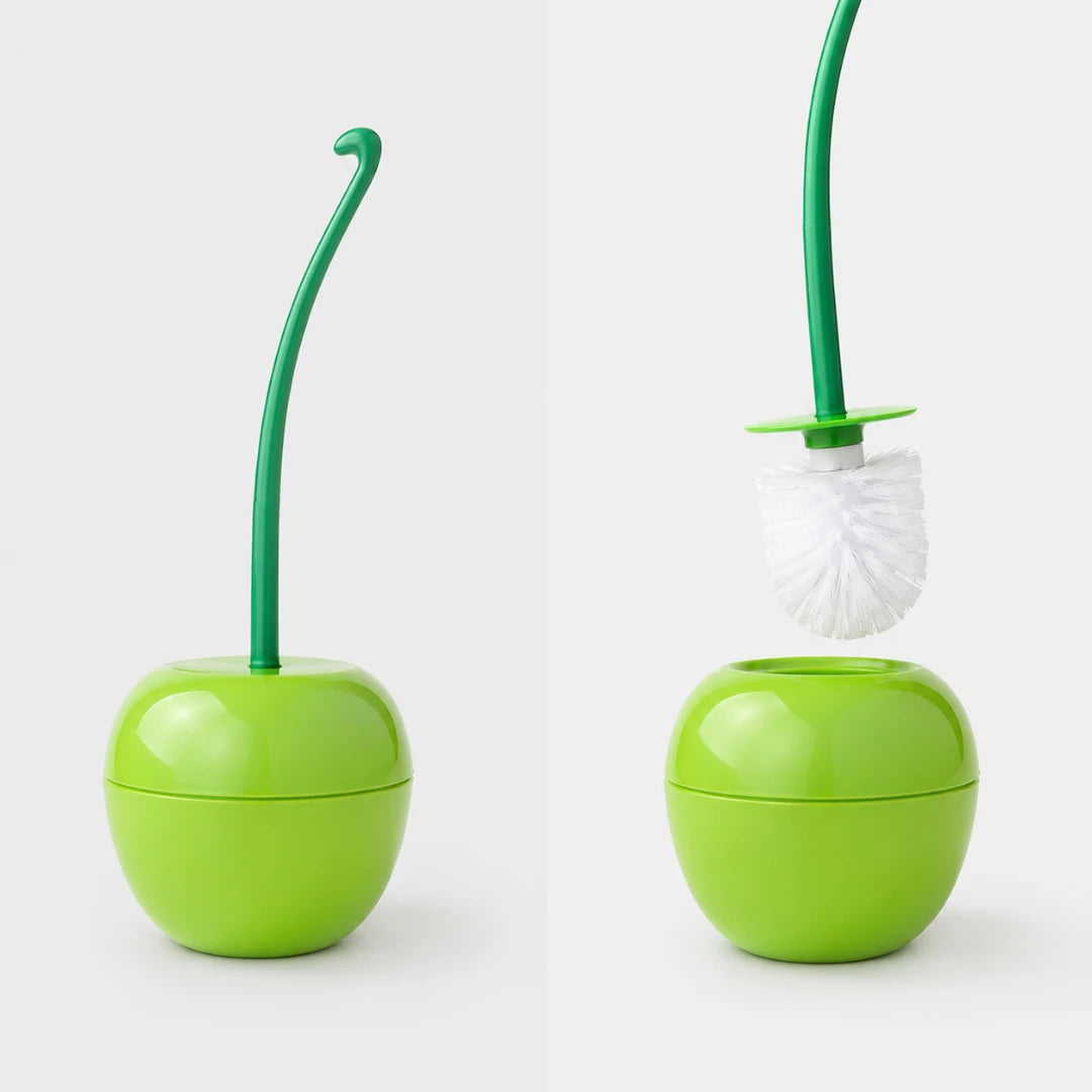 Josh & Tate - CherryPop™ Toilet Brush & Holder - Two views of a bright green apple-shaped toilet brush holder with a green stem-like handle and white bristle brush, shown on a light gray studio background.