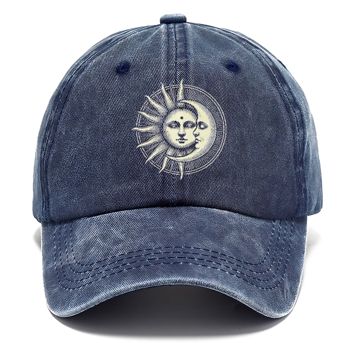 Blue baseball cap with sun and moon design on a white background