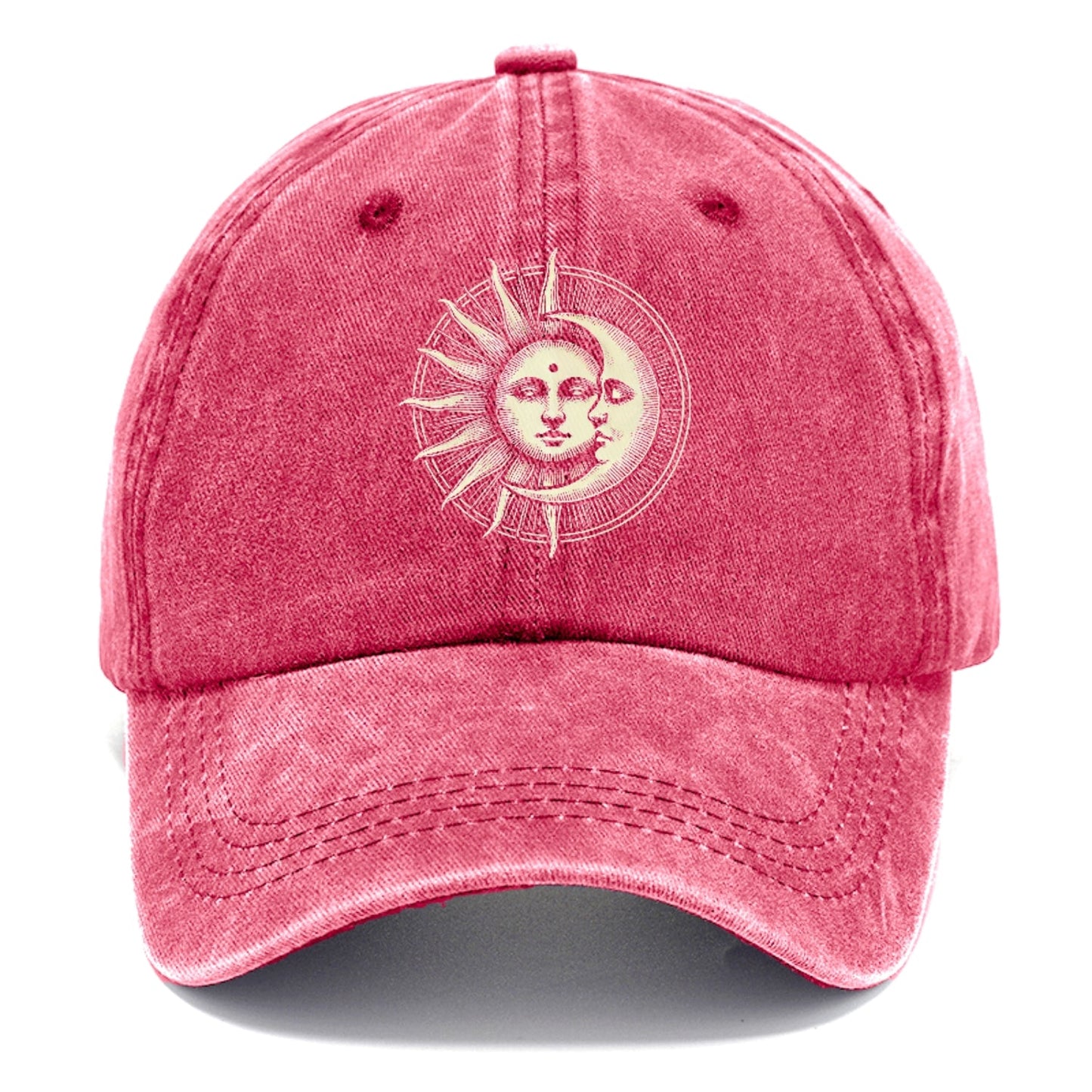 Pink cap with a sun and moon design on a white background