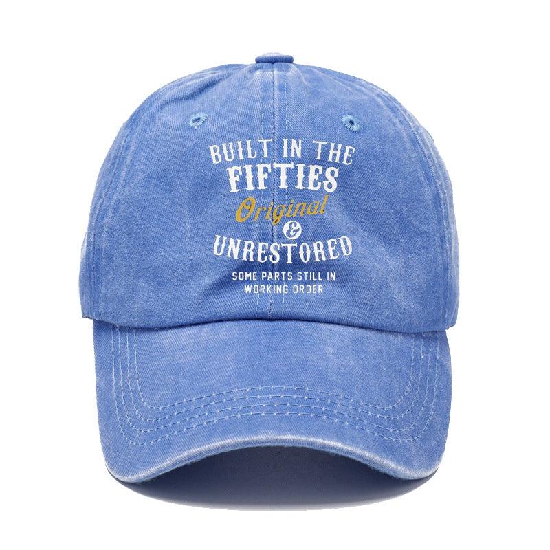 Blue cap with text 'Built in the Fifties, Original & Unrestored' on a white background