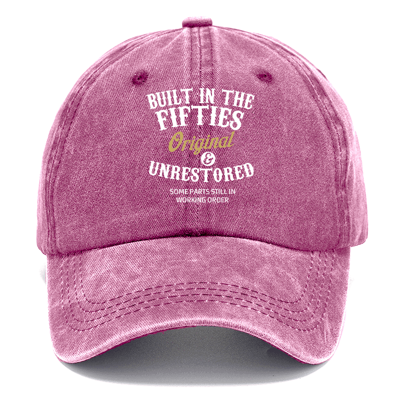 Pink cap with text 'Built in the Fifties' on a white background
