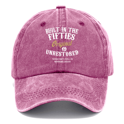 Pink cap with text 'Built in the Fifties' on a white background