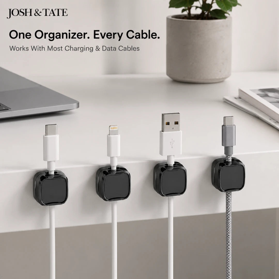 Josh & Tate - ClipCube™ Magnetic Cable Organizer - Cable organizers holding charging cables on a desk with 'Josh & Tate' branding.