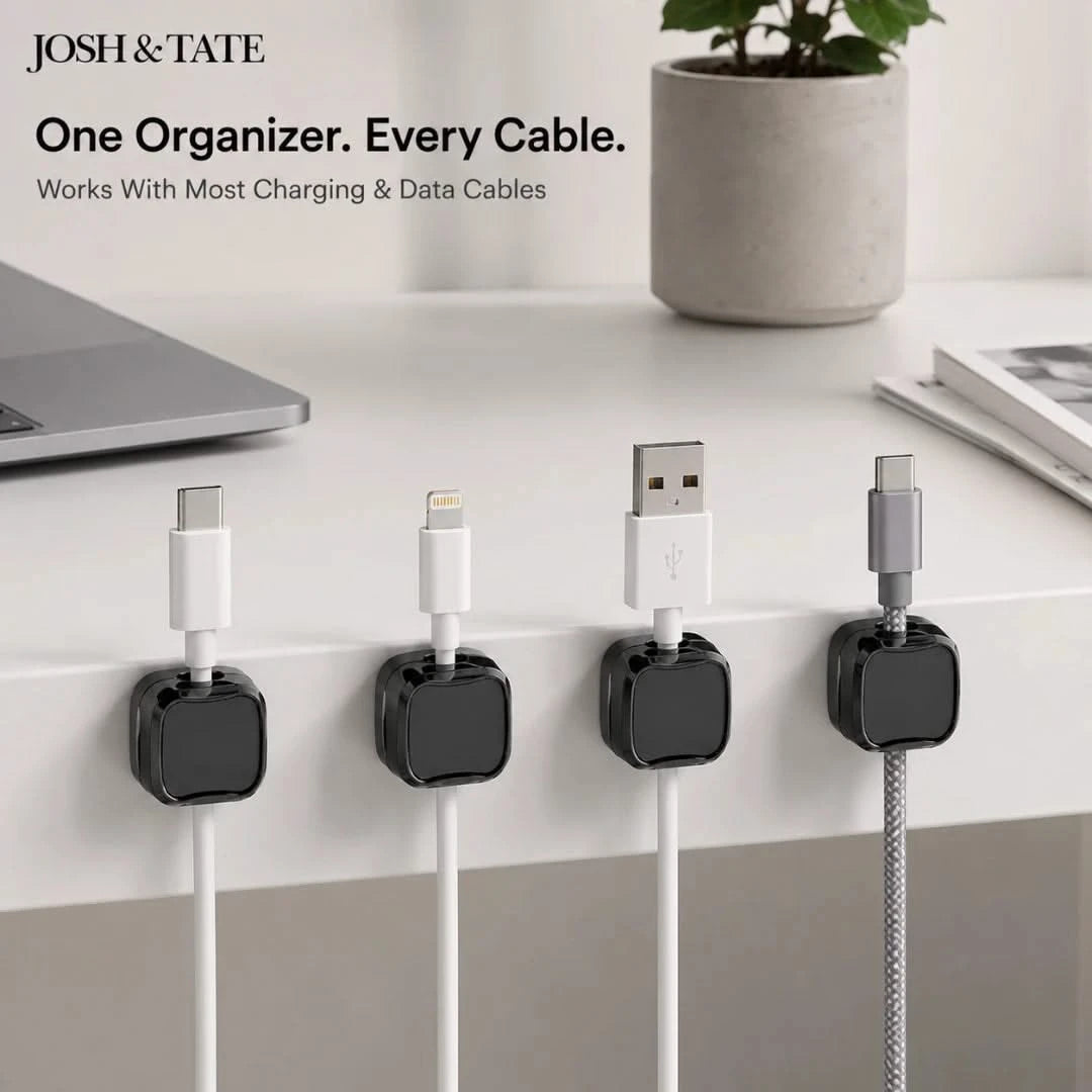 Josh & Tate - ClipCube™ Magnetic Cable Organizer - Cable organizers holding charging cables on a desk with 'Josh & Tate' branding.