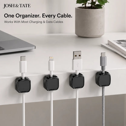 Josh & Tate - ClipCube™ Magnetic Cable Organizer - Cable organizers holding charging cables on a desk with 'Josh & Tate' branding.