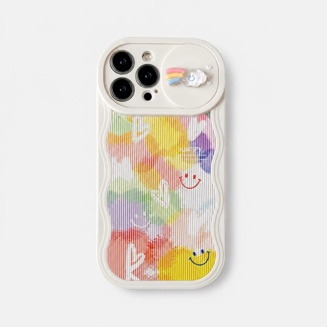 Josh & Tate - CloudPop™ Sliding Lens iPhone Case - A white phone case with a colorful pastel watercolor pattern featuring smiley faces and cactus silhouettes, shown on a light gray background.
