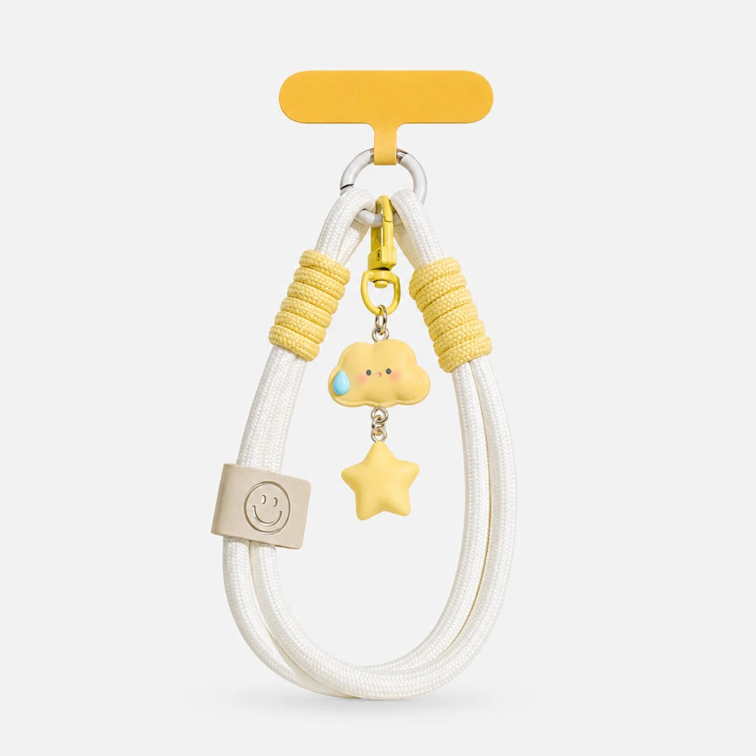 Josh & Tate - CloudStar™ Phone Lanyard - A white braided cord keychain or bag charm with yellow accents, featuring a small cloud charm with a blue tear drop, a yellow star, and yellow wrapped cord sections, shown on a light gray background.