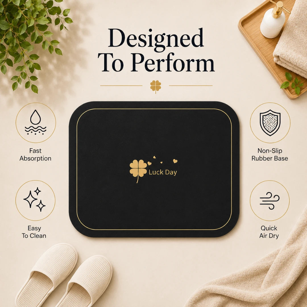 Josh & Tate - CloverDry™ Diatomite Bath Mat - Black mat with 'Luck Day' logo on a beige surface, surrounded by text and icons about product features.