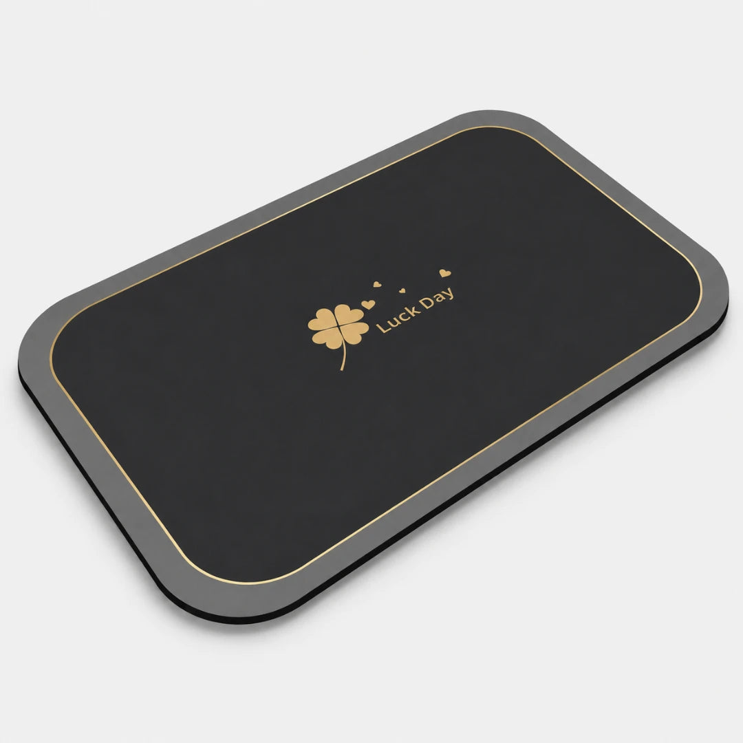Josh & Tate - CloverDry™ Diatomite Bath Mat - Black and gray mouse pad with a four-leaf clover design and 'Luck Day' text on a white background