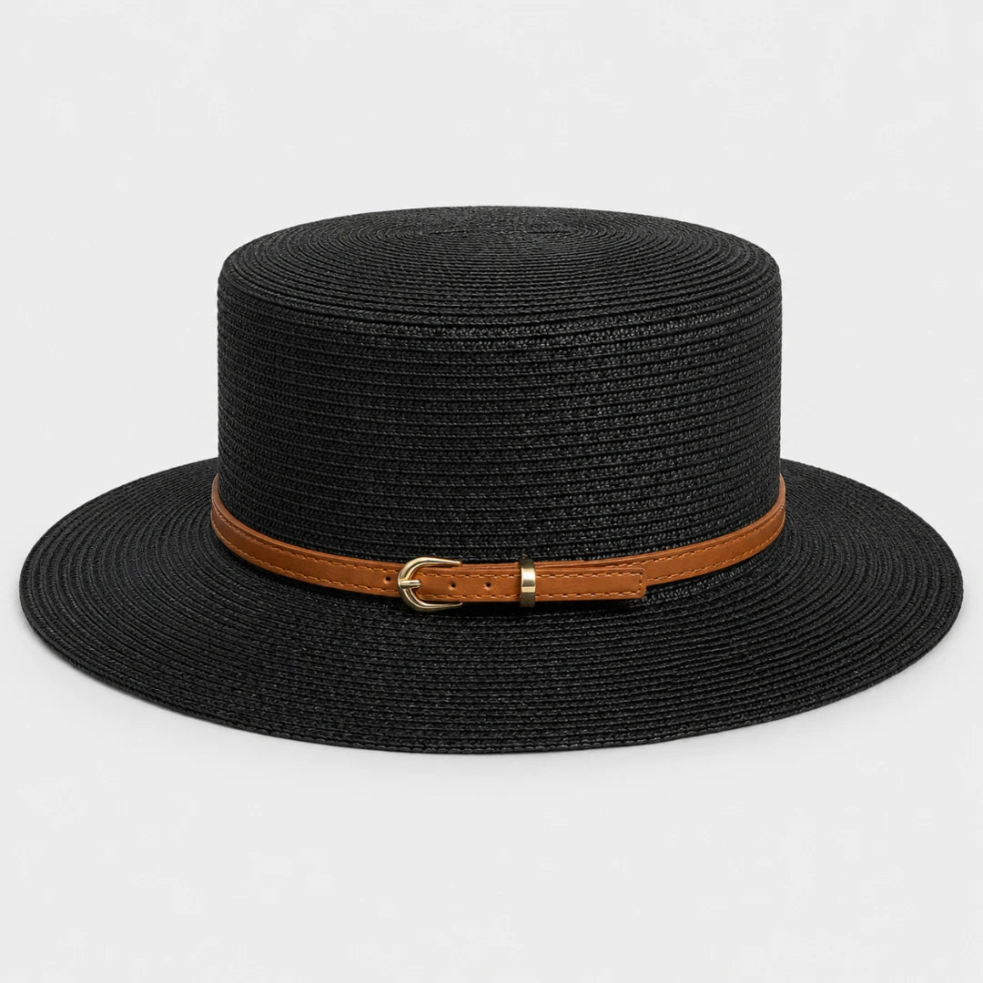 Josh & Tate - CoastBuckle™ Flat-Top Straw Hat - A black woven straw boater hat with a brown leather band and a gold-tone buckle, shown against a plain light gray background.