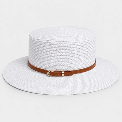 Josh & Tate - CoastBuckle™ Flat-Top Straw Hat - A white woven straw sun hat with a brown leather band and a small gold buckle, shown against a plain light gray background.