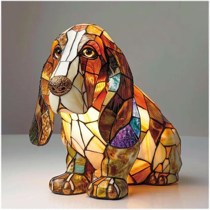 Stained glass dog-shaped lamp on a plain background