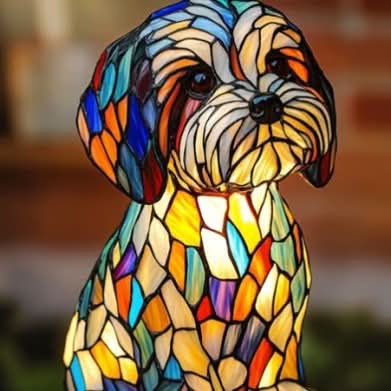 Colorful stained glass dog-shaped lamp on a blurred background