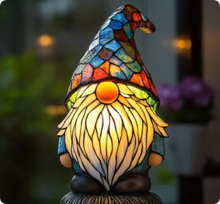 Colorful stained glass gnome lamp with a blurred background