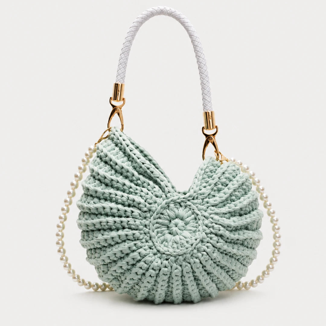 Josh & Tate - ConchKnit™ Pearl Handbag - Light blue knitted handbag with a white strap on a light gray background