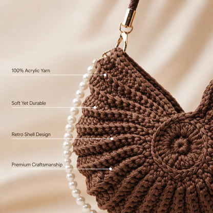 Josh & Tate - ConchKnit™ Pearl Handbag - Brown crochet bag with pearl strap on a beige background