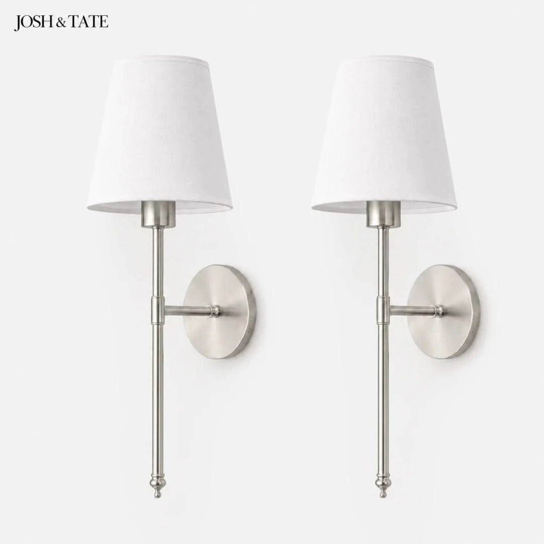 Josh & Tate - Cordless Fabric Wall Light - Pair of wall sconces with white lampshades and metallic finish on a white background, featuring the brand 'Josh & Tate'.