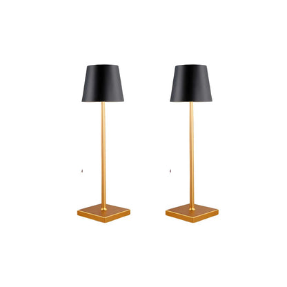 Two black table lamps with gold bases on a white background