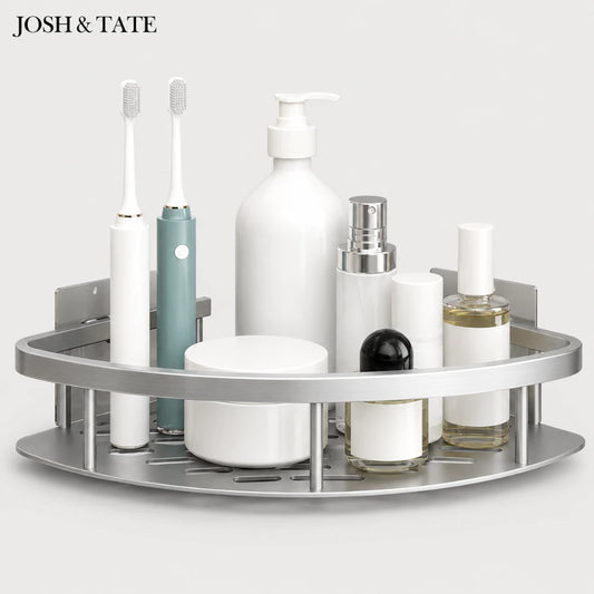 Josh & Tate - CornerLock™ Adhesive Shower Shelf - Bathroom corner shelf with various toiletries including bottles and a toothbrush on a white background.
