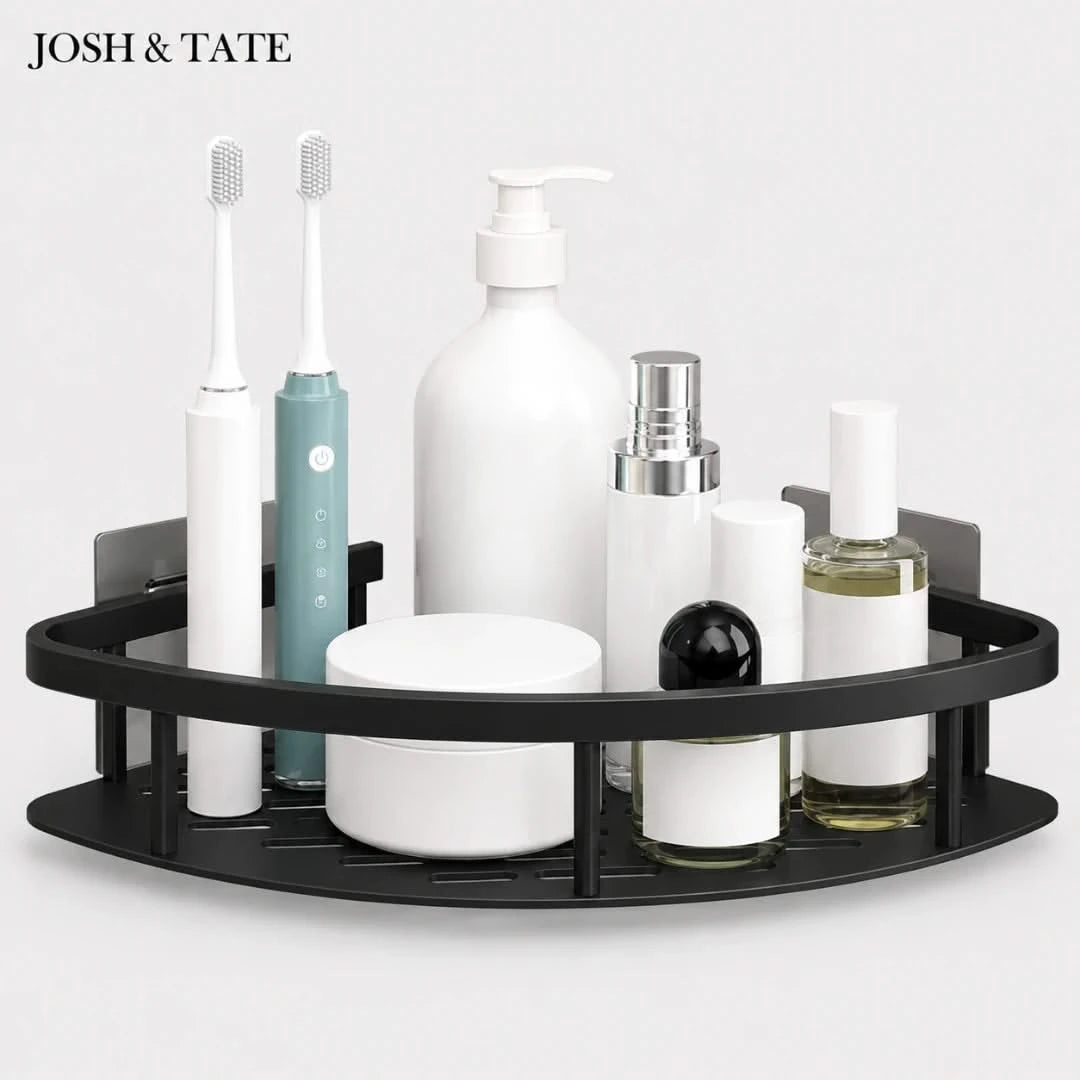 Josh & Tate - CornerLock™ Adhesive Shower Shelf - Black corner shelf with various bathroom products including bottles and a toothbrush on a white background.