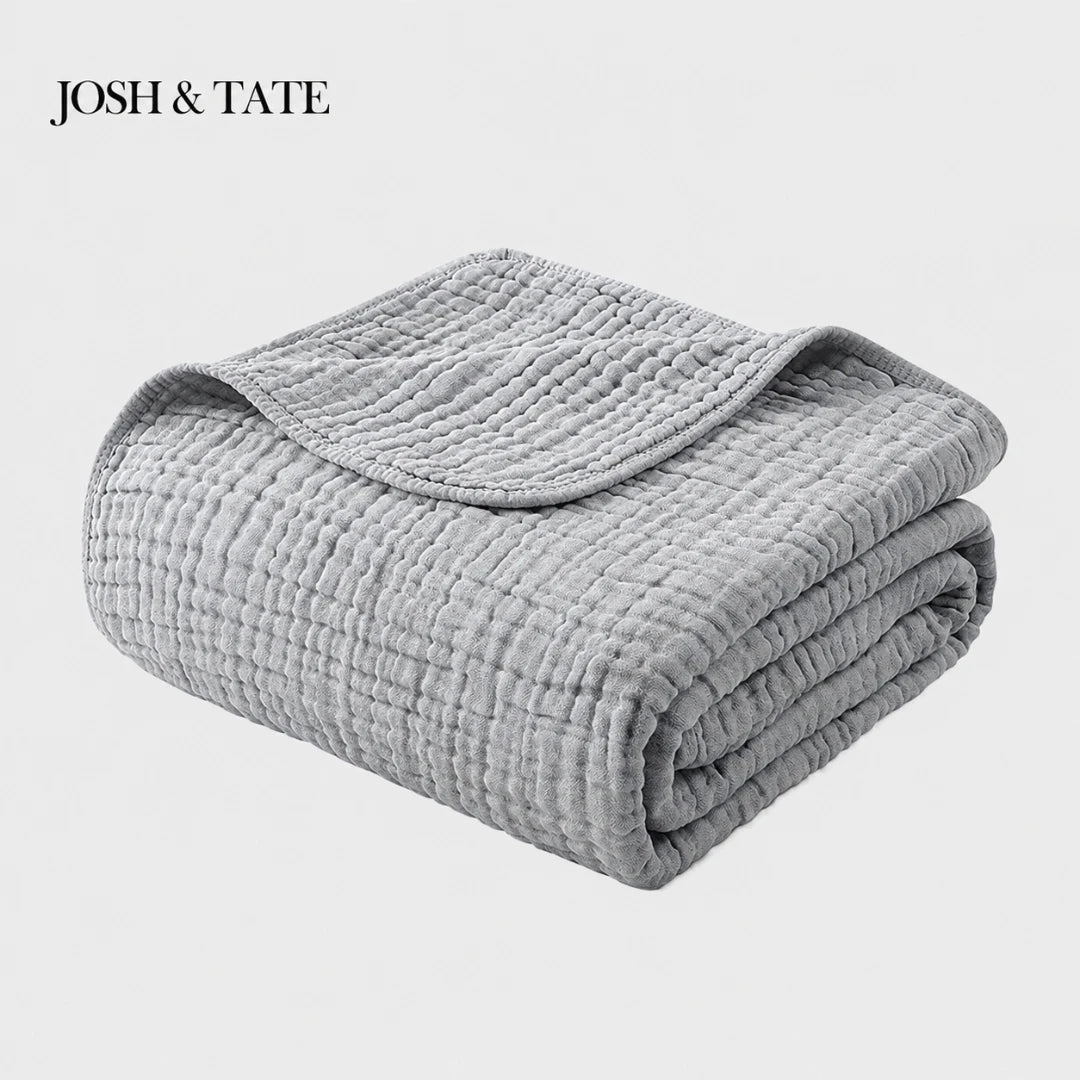 Josh & Tate - CottonFold™ Thick Air Conditioner Blanket - Folded gray quilt with 'Josh & Tate' branding on a white background