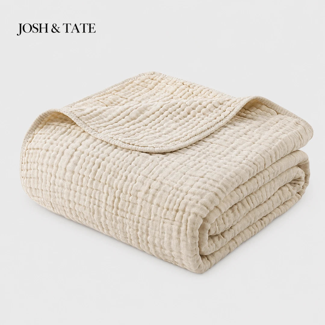Josh & Tate - CottonFold™ Thick Air Conditioner Blanket - Folded beige quilt with 'Josh & Tate' branding on a light gray background