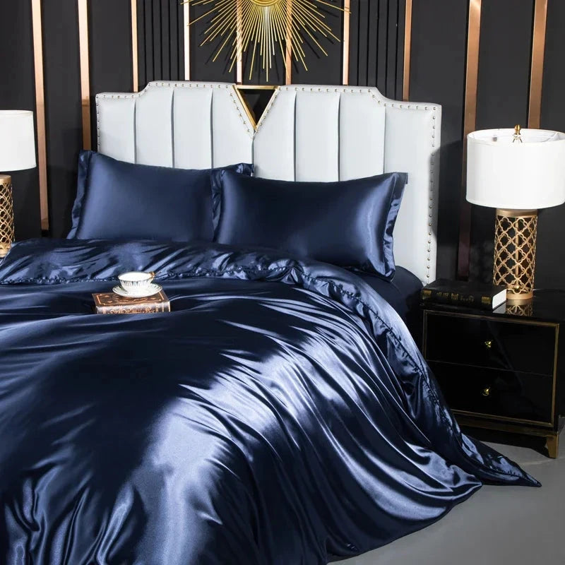 Josh & Tate - Josh & Tate - FloraStep™ Satin Fur-Lined Slipper - Navy satin bedding set on a bed with matching pillows, in a bedroom setting.