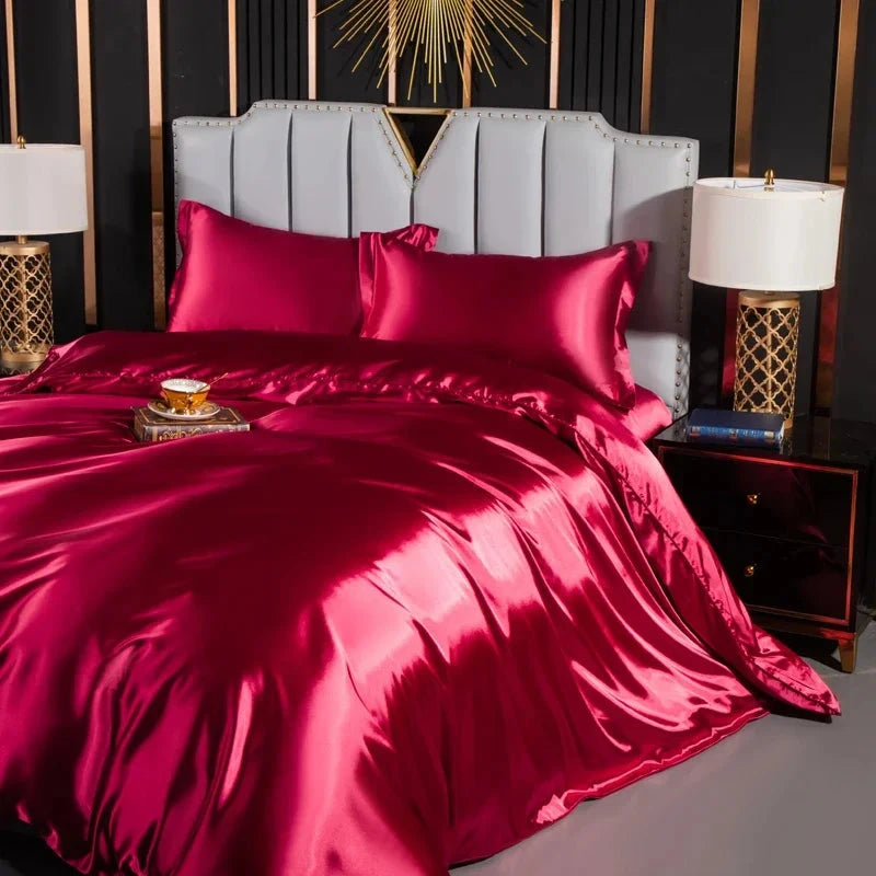 Josh & Tate - Josh & Tate - FloraStep™ Satin Fur-Lined Slipper - Bed with red satin bedding in a stylish bedroom setting.