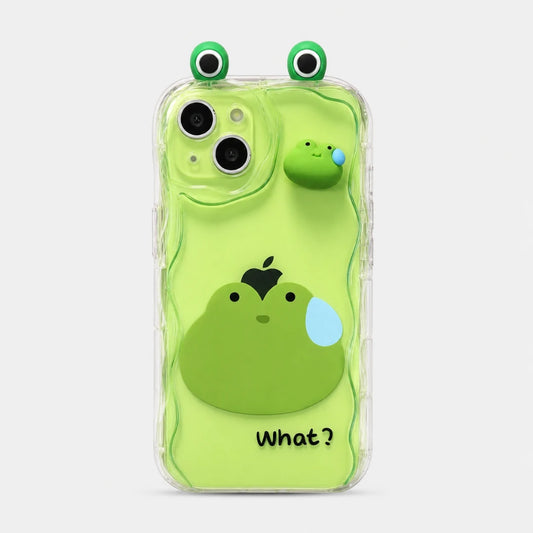 Josh & Tate - CuteSilicone™ iPhone Case - A clear phone case with a bright green 3D cartoon frog design, featuring a large frog face on the back, a smaller frog popping up from the side, and two green-and-white eye decorations on the top. The word 'What?' is printed near the bottom.