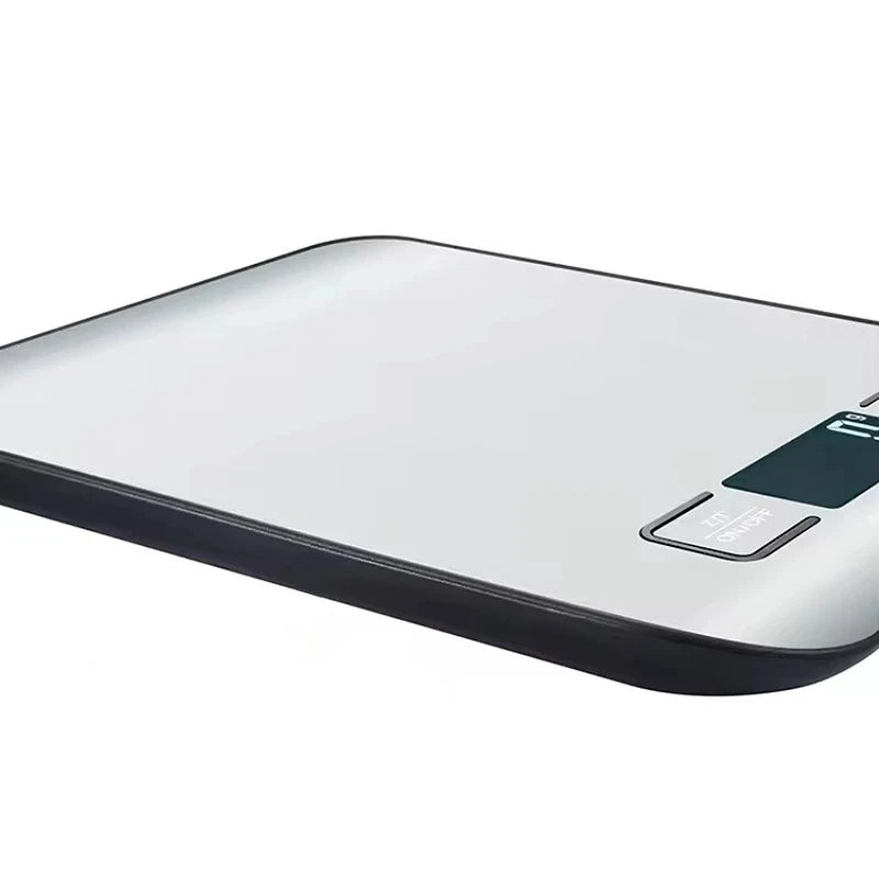 Digital kitchen scale with a glass platform on a white background