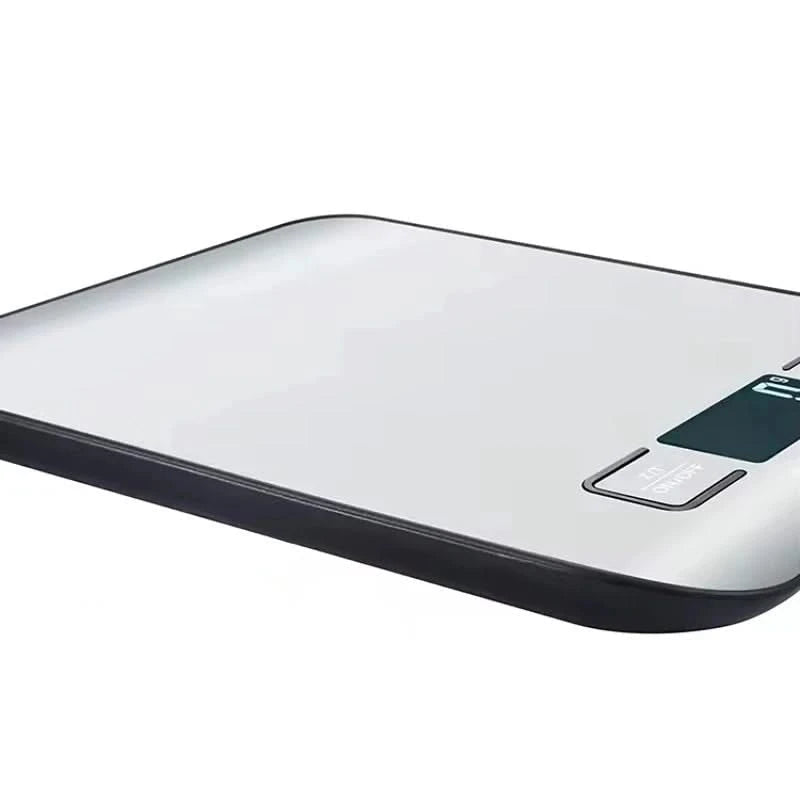 Digital kitchen scale with a glass platform on a white background
