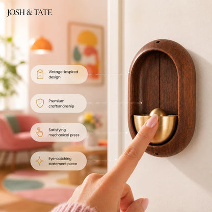 Josh & Tate - DingBell™ Retro Dopamine Door Bell - Wooden and brass wall-mounted object with hand pressing it, set against a blurred indoor background.