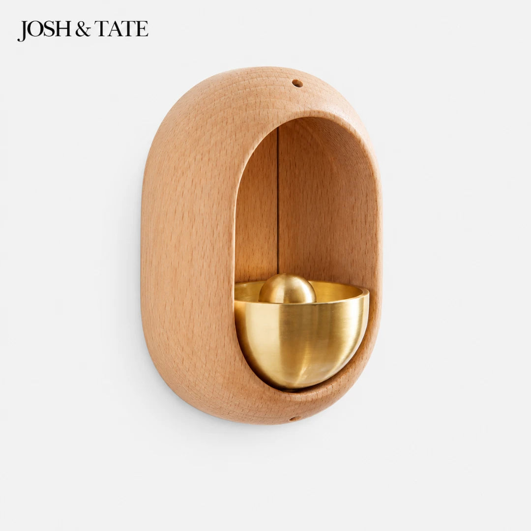 Josh & Tate - DingBell™ Retro Dopamine Door Bell - Wooden and gold decorative item with 'JOSH & TATE' branding on a white background