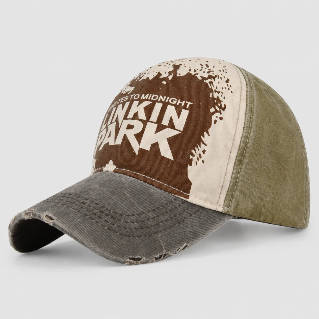 Josh & Tate - DistressedCap™ Embroidered Baseball Cap - A distressed trucker-style baseball cap featuring the Linkin Park 'Colors to Midnight' album artwork on the front panel, with an olive green back and a gray brim, shown on a light gray background.
