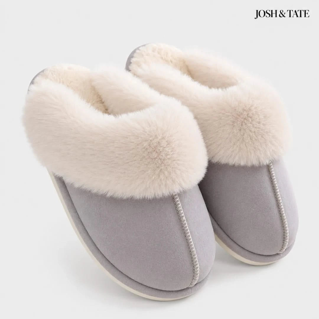 Josh & Tate - DriftWalk™ Plush Slippers - Gray slippers with white fur lining on a light gray background, featuring the brand 'Josh & Tate'.