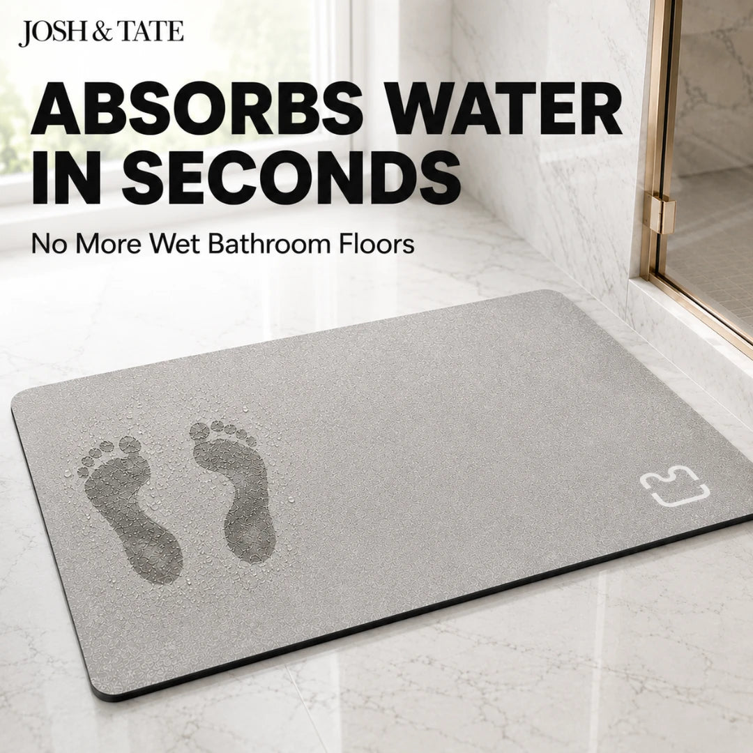 Josh & Tate - DryStep™ Diatomite Non-Slip Bath Mat - Gray mat with footprints on a bathroom floor, featuring text about water absorption.