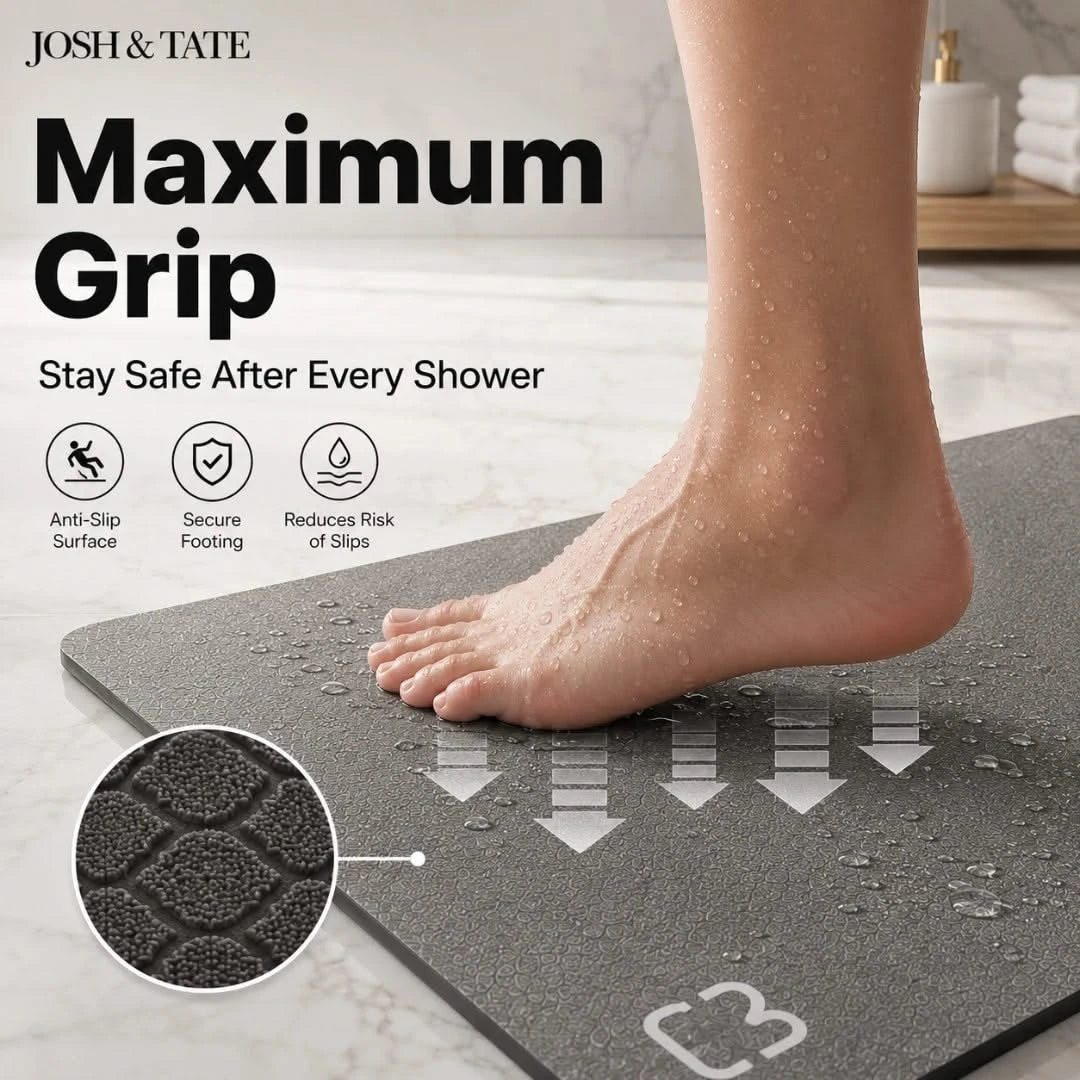 Josh & Tate - DryStep™ Diatomite Non-Slip Bath Mat - Gray non-slip mat with a foot on it, labeled 'Maximum Grip' by Josh & Tate.