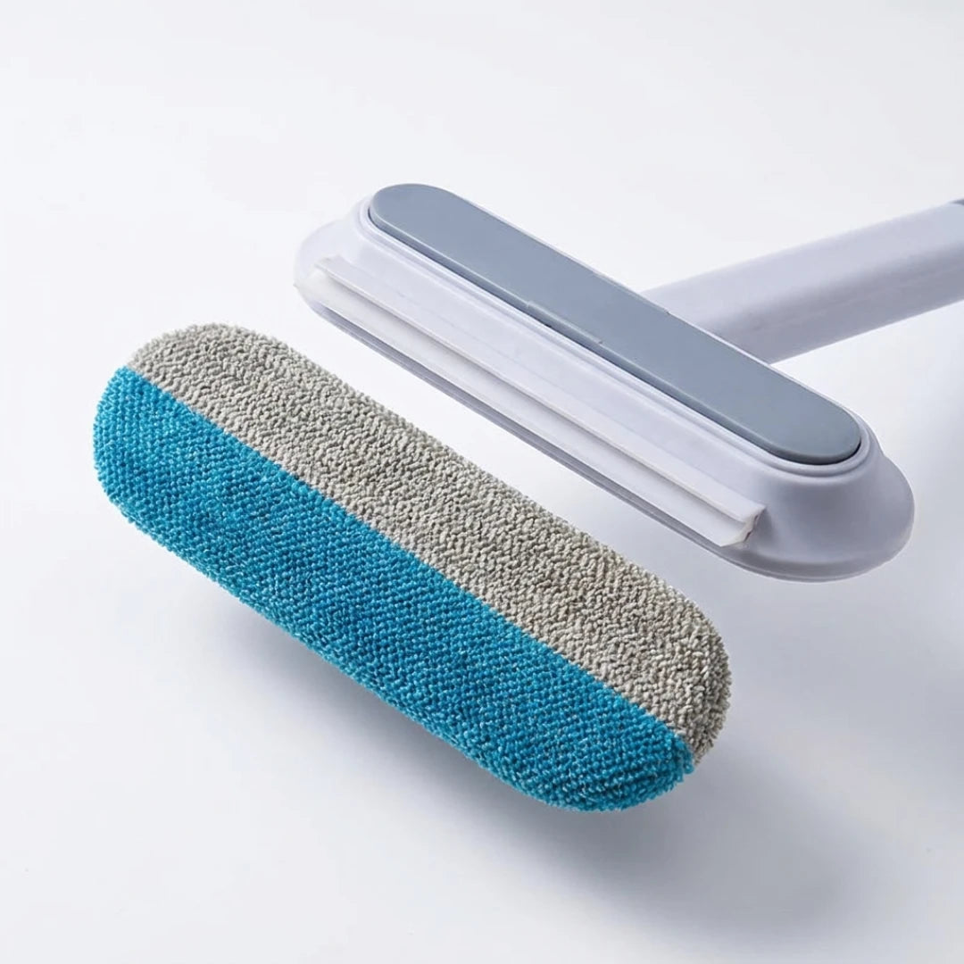 Josh & Tate - DualSwipe™ Multi-Surface Pet Hair Brush - Cleaning tool with a blue and gray roller on a white background
