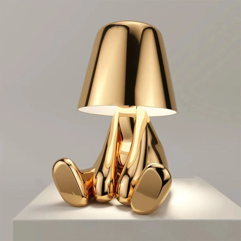 Gold lamp with a unique design on a gray background