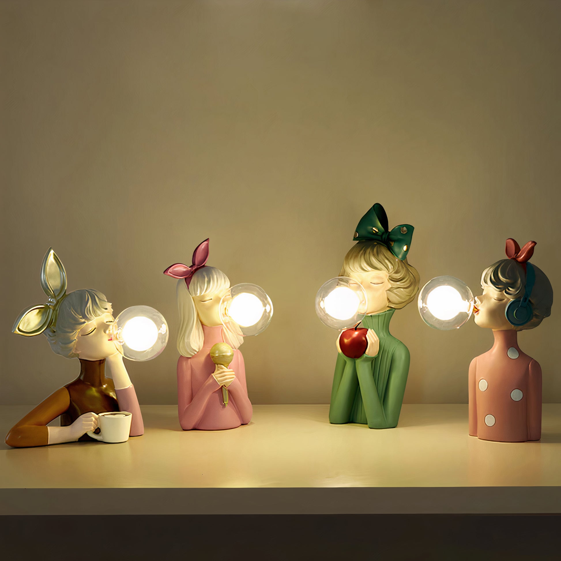 Four decorative figurines with light bulbs for heads on a plain background