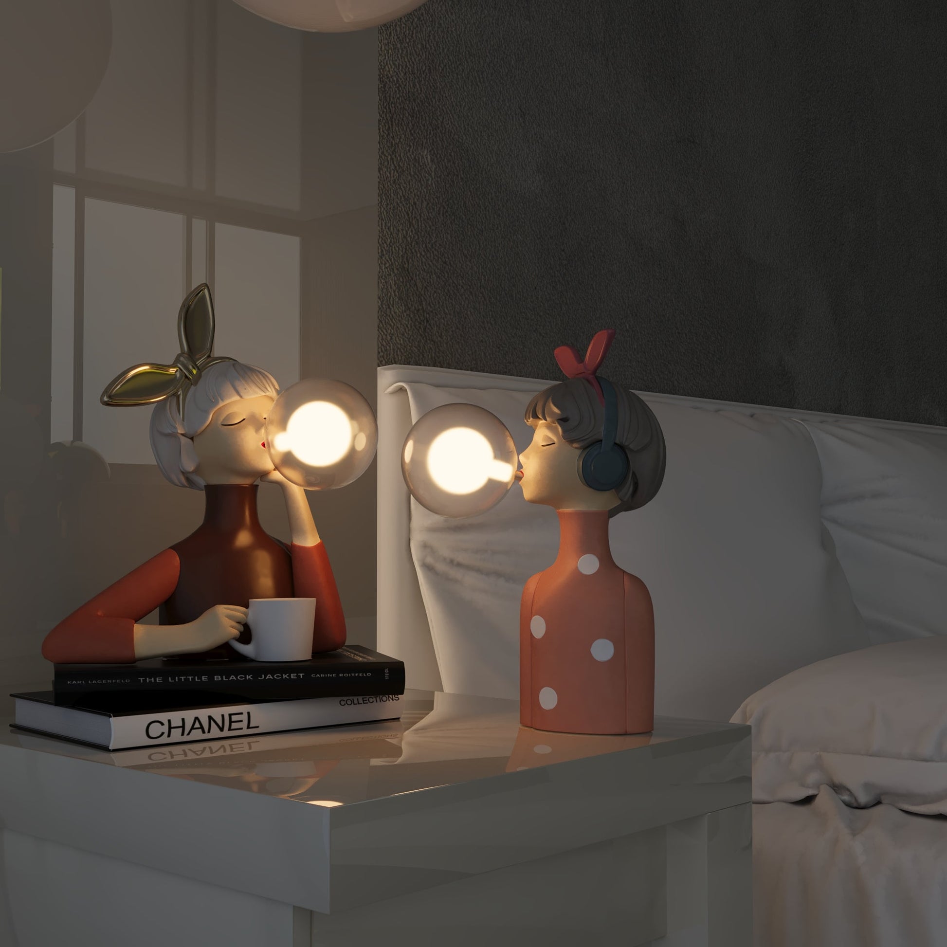 Two decorative lamps shaped like people on a table with books and a mirror in the background.