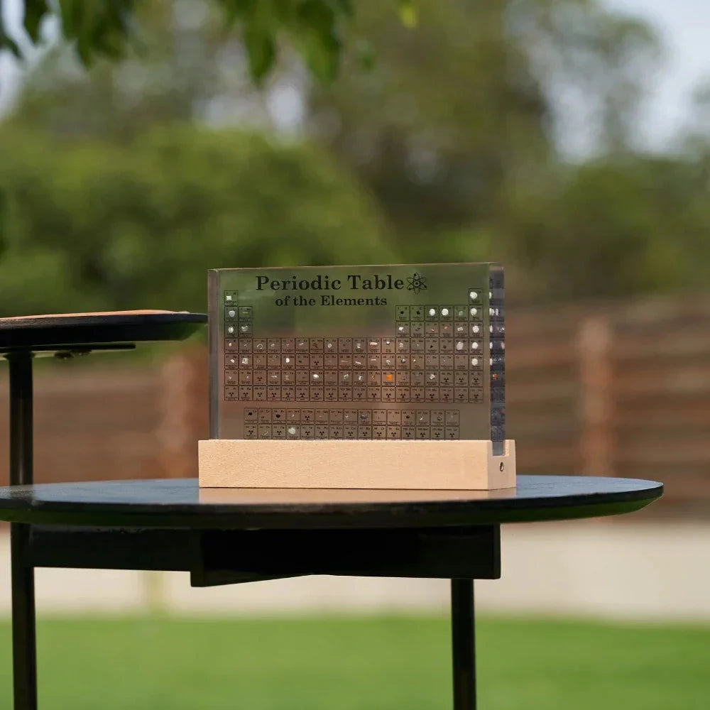 Josh & Tate - Elementa Periodic Table - Periodic Table of Elements on a wooden stand outdoors