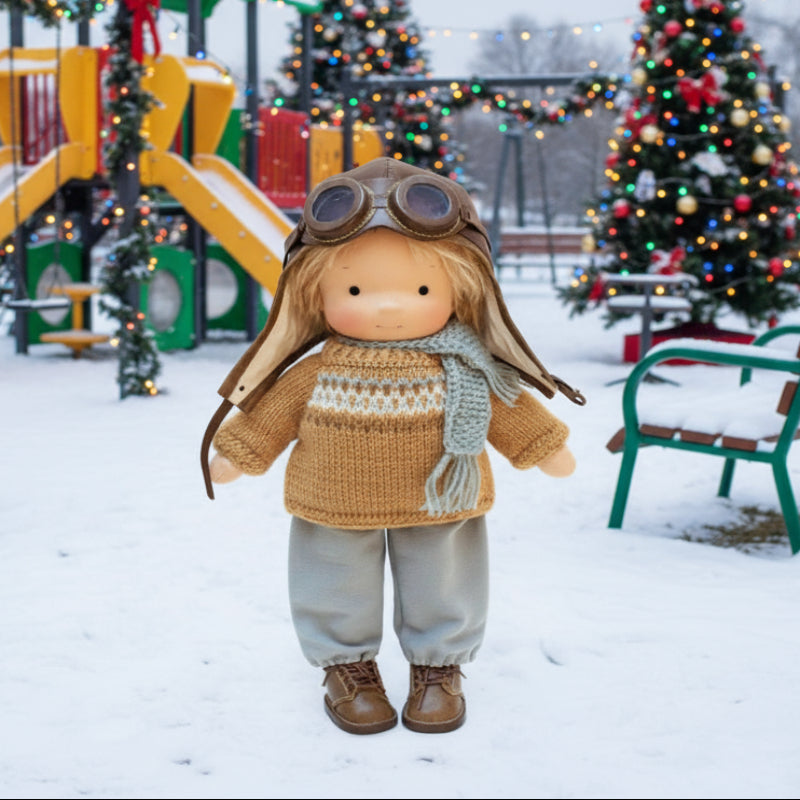 Toy figure in winter clothing with a snowy background