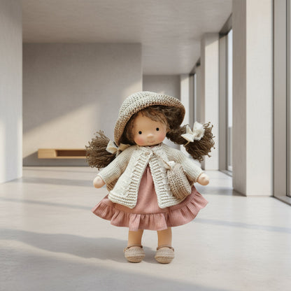 Stuffed doll with a knitted outfit in a minimalistic room
