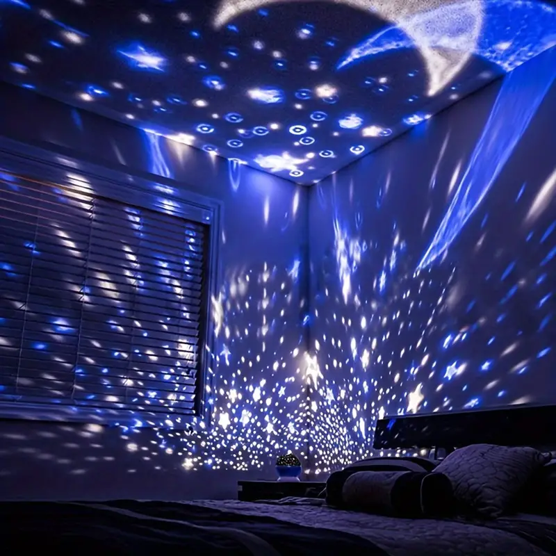 Room with starry light projection on ceiling and walls