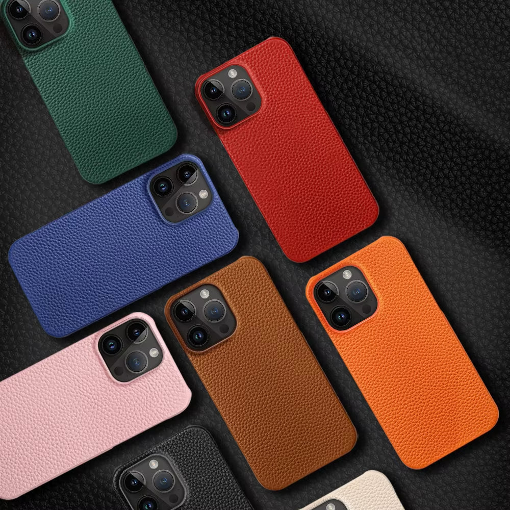 Collection of phone cases in various colors on a textured surface